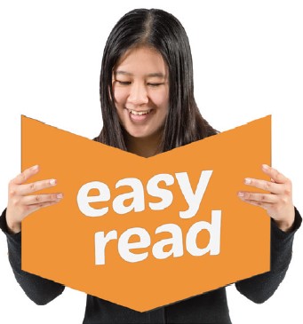 A person reading an Easy Read version of a document