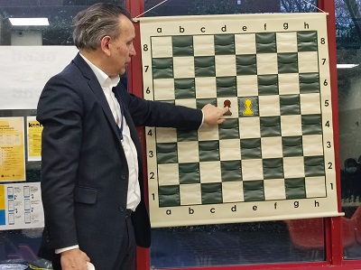 Image showing a tutor and chess board to promote a chess club at Stanmore Library