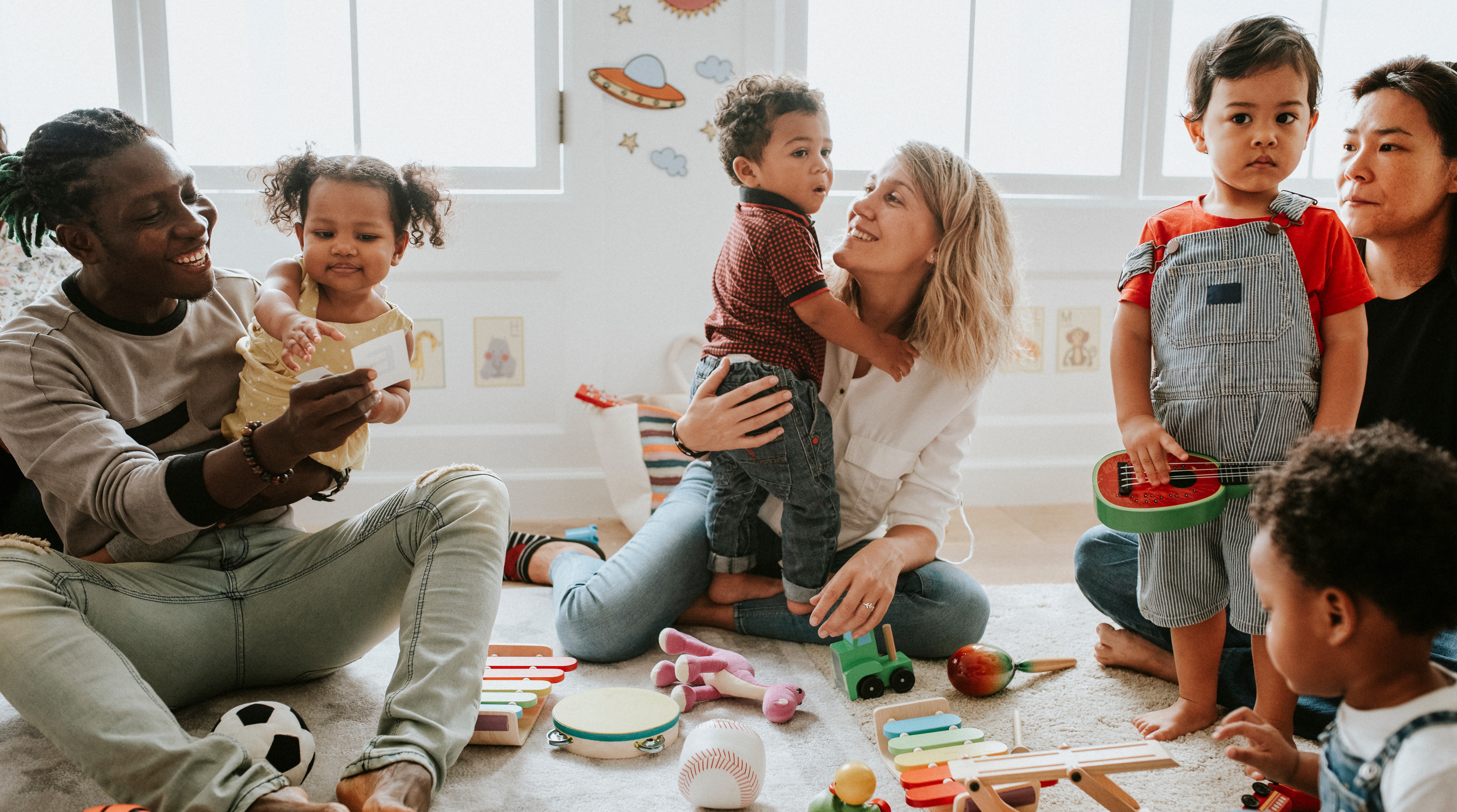 Children and parents playing in a setting