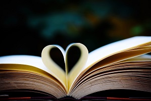 Image showing a book with pages folded into a heart shape to promote reading groups